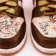 Illustration for article titled Uncharted-Themed Shoes Can Guide You in Drake's Steps